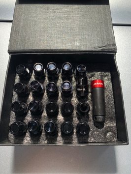 AMS Edition black two-piece wheel nuts with key in a presentation case